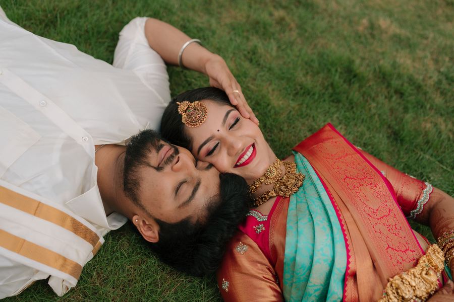 A couple lying together on the grass