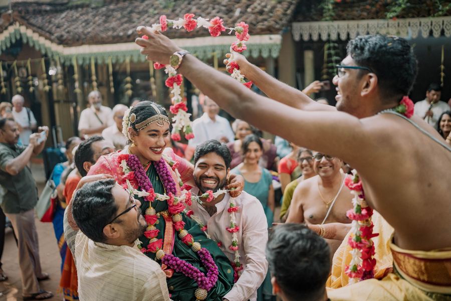 Guests throwing a garland during the ceremony